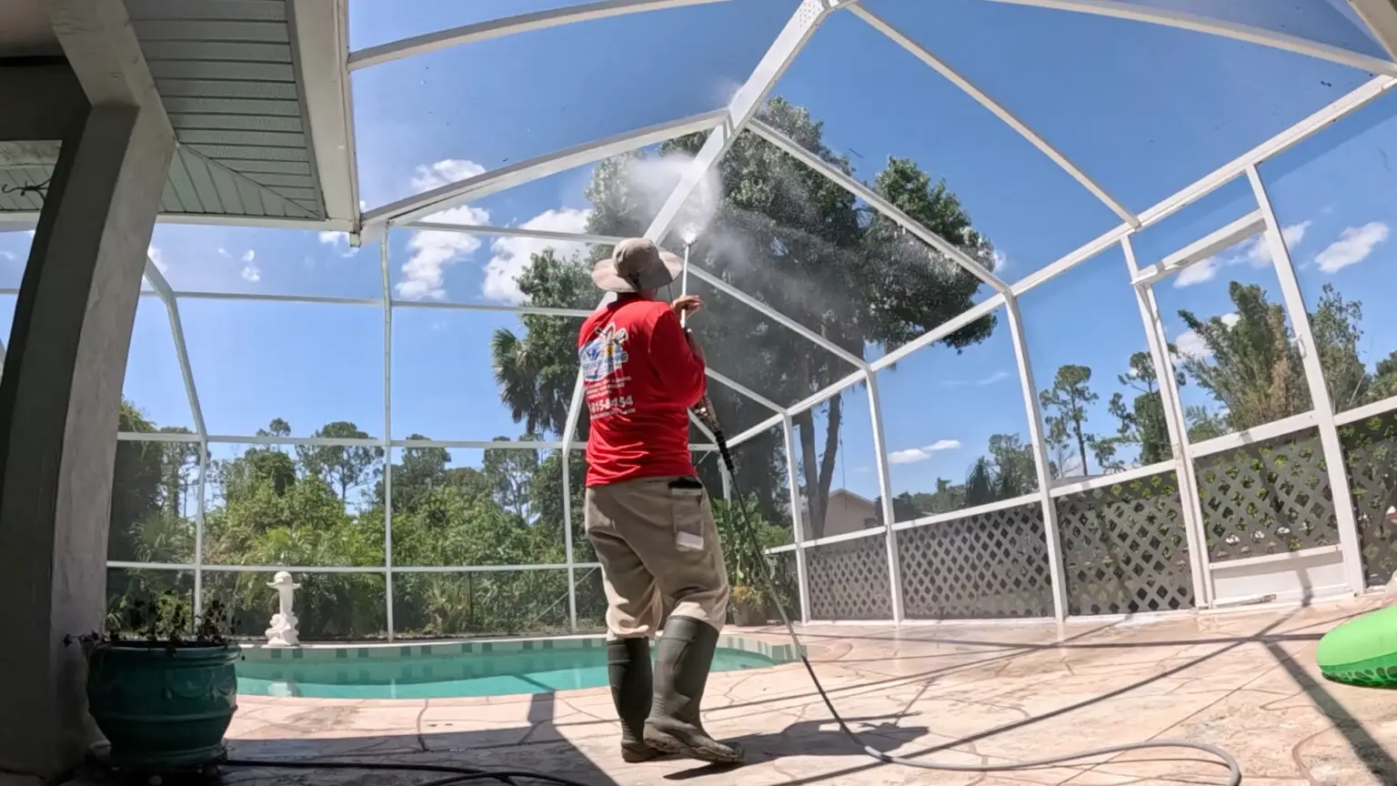 Pressure washing a pool cage enclosure